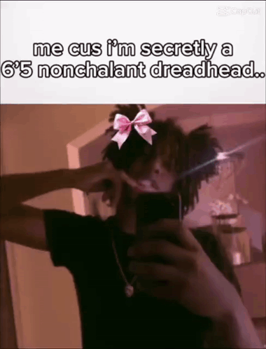 Person Taking Selfie With Bow on Head