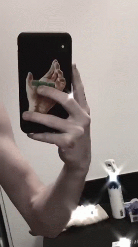 Person Taking Selfie With Phone