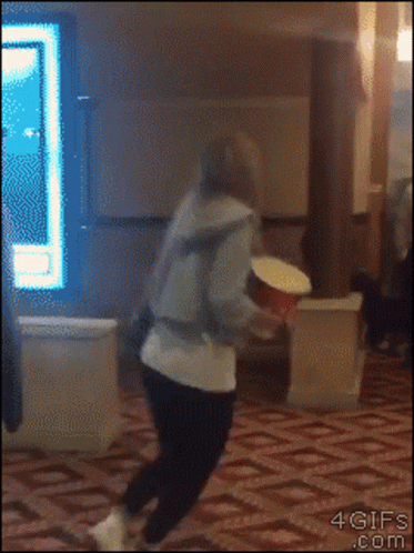 Person Throwing Popcorn Bucket GIF