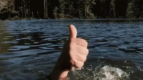 Person Thumbs Up Swimming in Lake