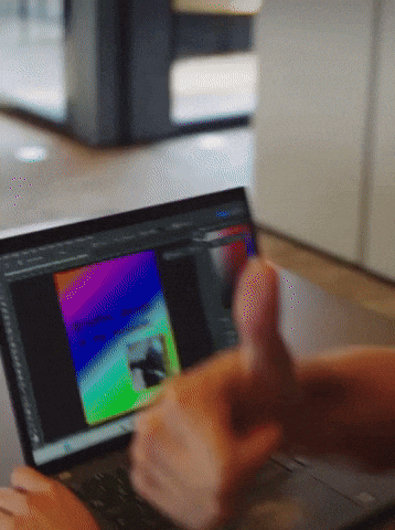 Person Thumbs Up Using Laptop