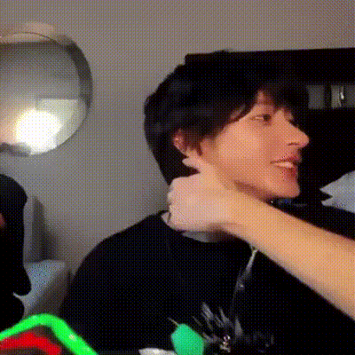 Person Touching Another's Ear While Sitting