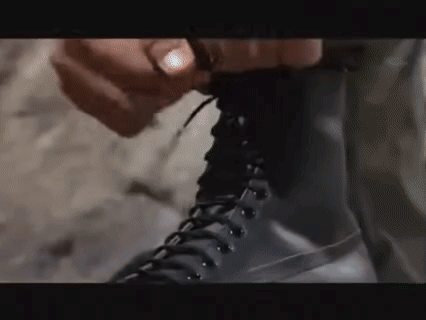 Person Tying A Boot GIF