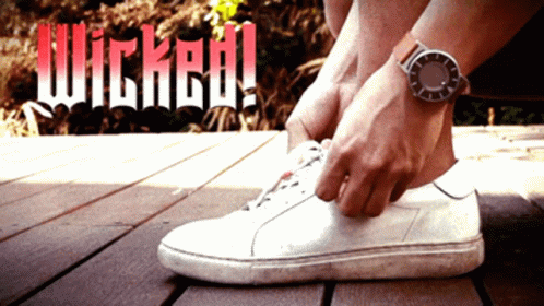 Person Tying Shoe With Wicked Behind GIF