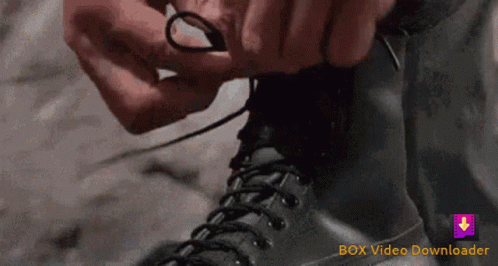 Person Tying Shoelaces With Box Video Downloader Logo