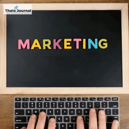 Person Typing at Marketing Blackboard