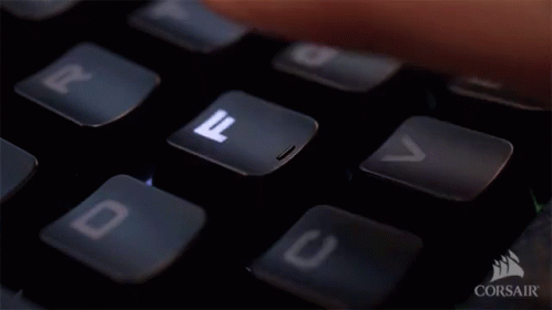 Person Typing Corsair Keyboard With Finger on D Key