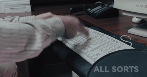 Person Typing On Keyboard With All Sorts GIF
