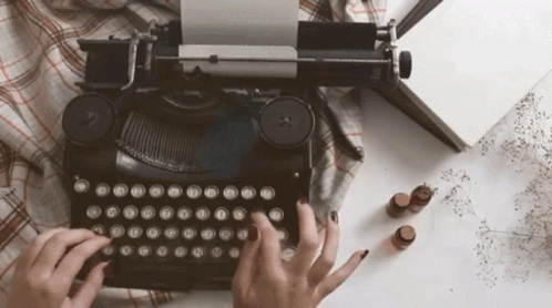 Person Typing On Old Typewriter With A B GIF