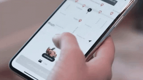 Person Using Cell Phone With Coming Soon Button GIF
