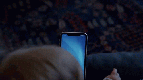Person Using Face Recognition Phone GIF