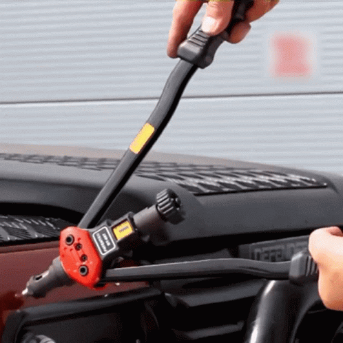 Person Using Rivet Gun With Simpson Sticker GIF