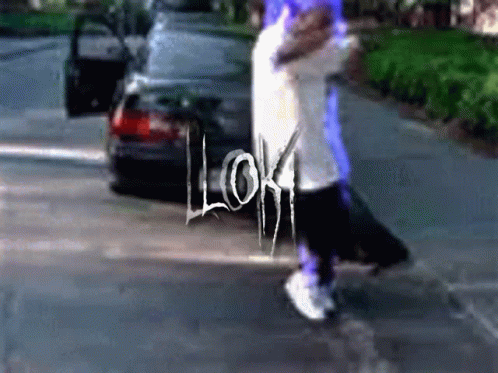 Person Walking Down Street Saying Loki GIF