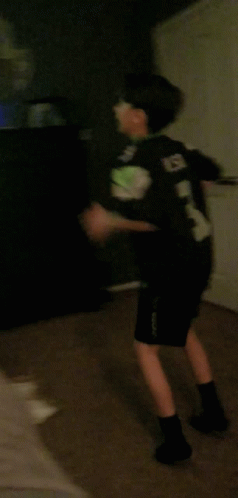 Person Walking In Dark Room With Red Star GIF