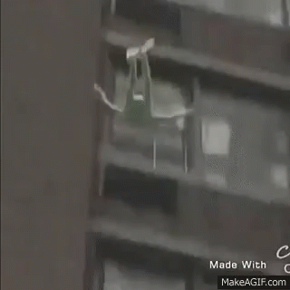 Person Walking In Front Of House GIF