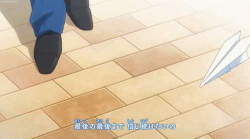 Person Walking on Tiled Floor with Chinese Writing