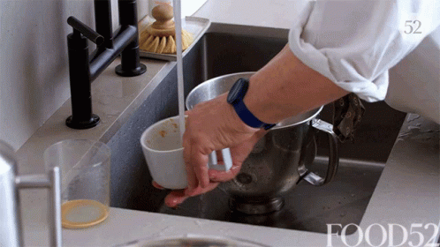 Person Washing Bowl in Kitchen Sink Number 52