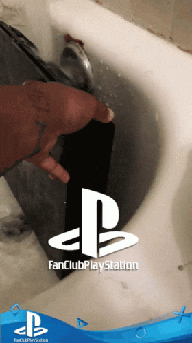 Person Washing PlayStation in Sink