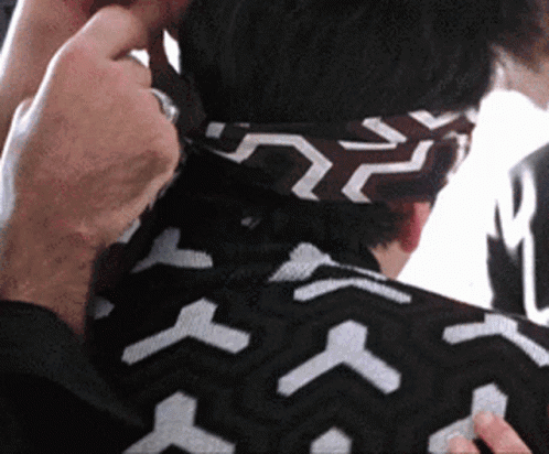 Person Wearing Black and White Headband With Arrows