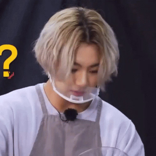 Person Wearing Face Mask and Apron With Question Mark