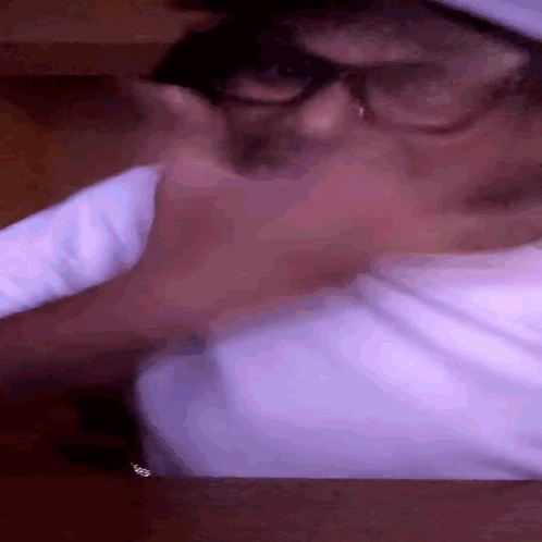 Person Wearing Glasses and White Shirt