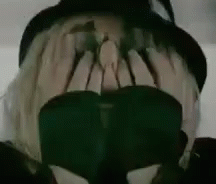 Person Wearing Hat and Sunglasses Covering Face