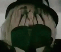Person Wearing Hat and Sunglasses Covering Face