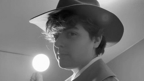 Person Wearing Hat Holding Light