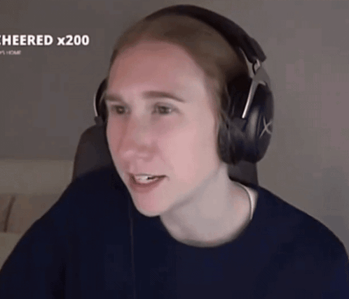 Person Wearing Headphones And Beanie Smiling GIF