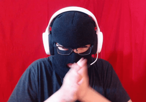 Person Wearing Headphones and Ski Mask