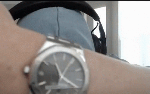 Person Wearing Headphones and Watch