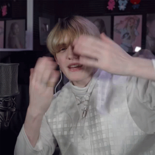 Person Wearing Headphones and White Square Shirt