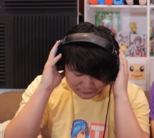 Person Wearing Headphones and Yellow Shirt
