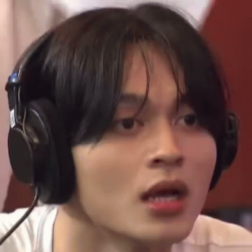 Person Wearing Headphones Making Face