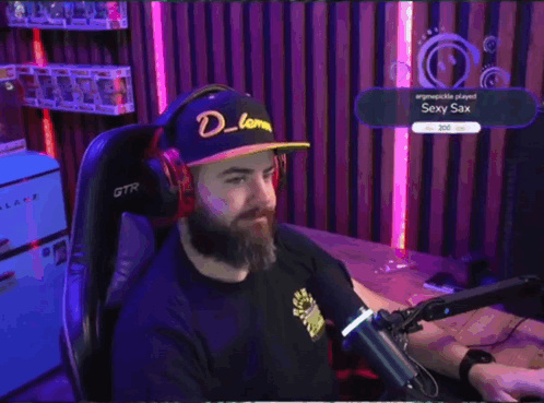 Person Wearing Headphones Next to Exercise Bike