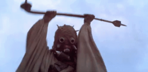 Person Wearing Mask Holding Stick GIF