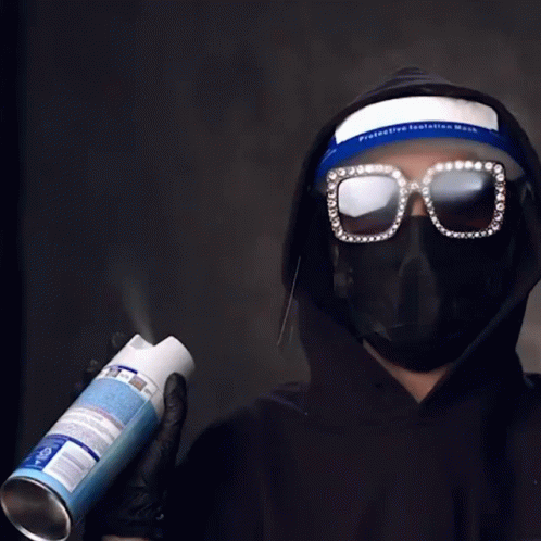 Person Wearing Mask Spraying Can GIF