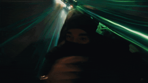 Person Wearing Mask Walking at Night