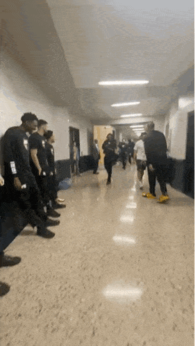Person Wearing NBA Shirt In Hallway GIF
