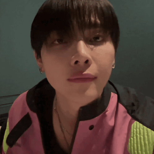 Person Wearing Pink and Green Jacket
