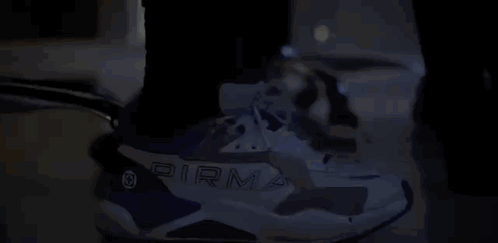 Person Wearing Pirma Blue and White Sneakers