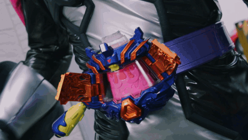Person Wearing Purple Belt With Orange Item GIF
