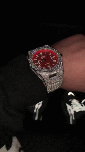 Person Wearing Red Watch with Diamonds