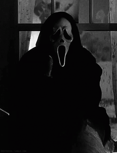 Person Wearing Scream Mask at Window