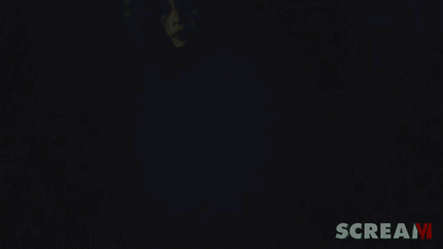 Person Wearing Scream Mask Saying Scream