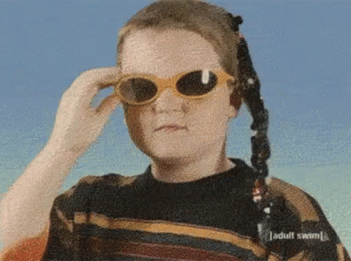 Person Wearing Sunglasses and Adult Swim Sweater