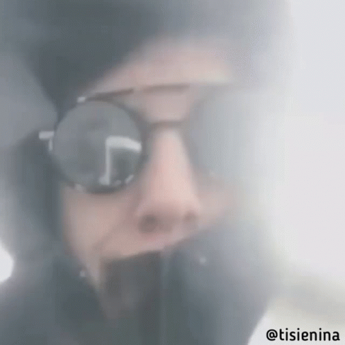 Person Wearing Sunglasses and Hoodie