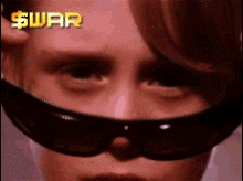 Person Wearing Sunglasses With Dollar Sign
