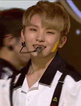 Person Wearing Suspenders and Microphone