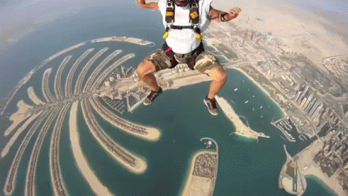 Person Wearing Vis Helmet Flying Through Air